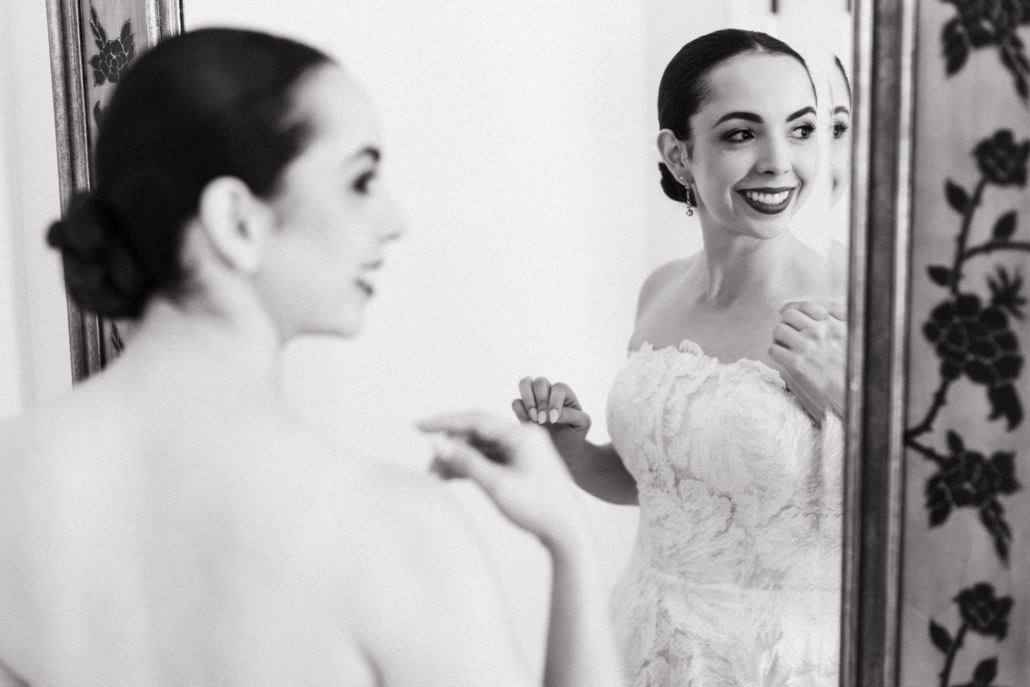Your Wedding Getting Ready Space: The Third Venue That Tells Your Story 3 03 bride putting on earrings mirror