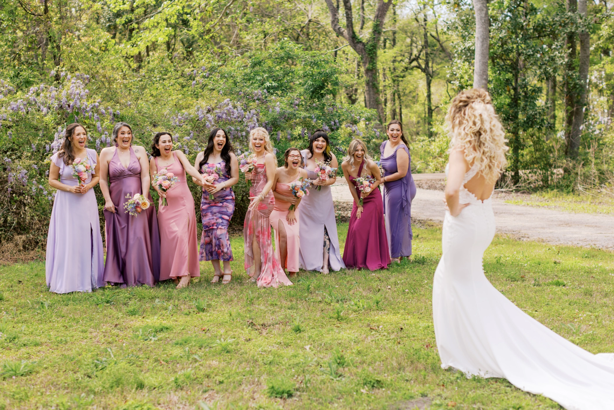 Bridesmaids cheering and screaming as they turn around to see Taylor in her wedding gown for the first time