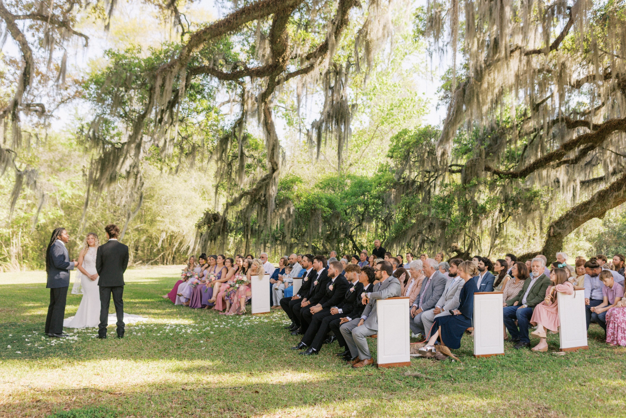 Wedding ceremony under oak trees with Spanish moss at Keystone Oaks Estate Louisiana